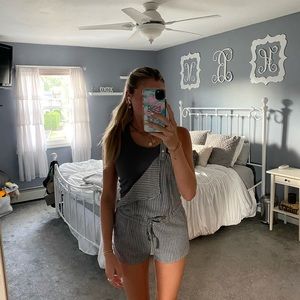 grey and white stripped overalls